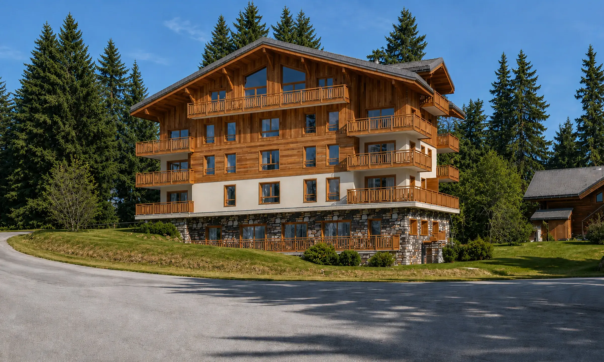 Vue extérieure du Chalet Caribou aux Saisies en été, résidence de prestige à la montagne